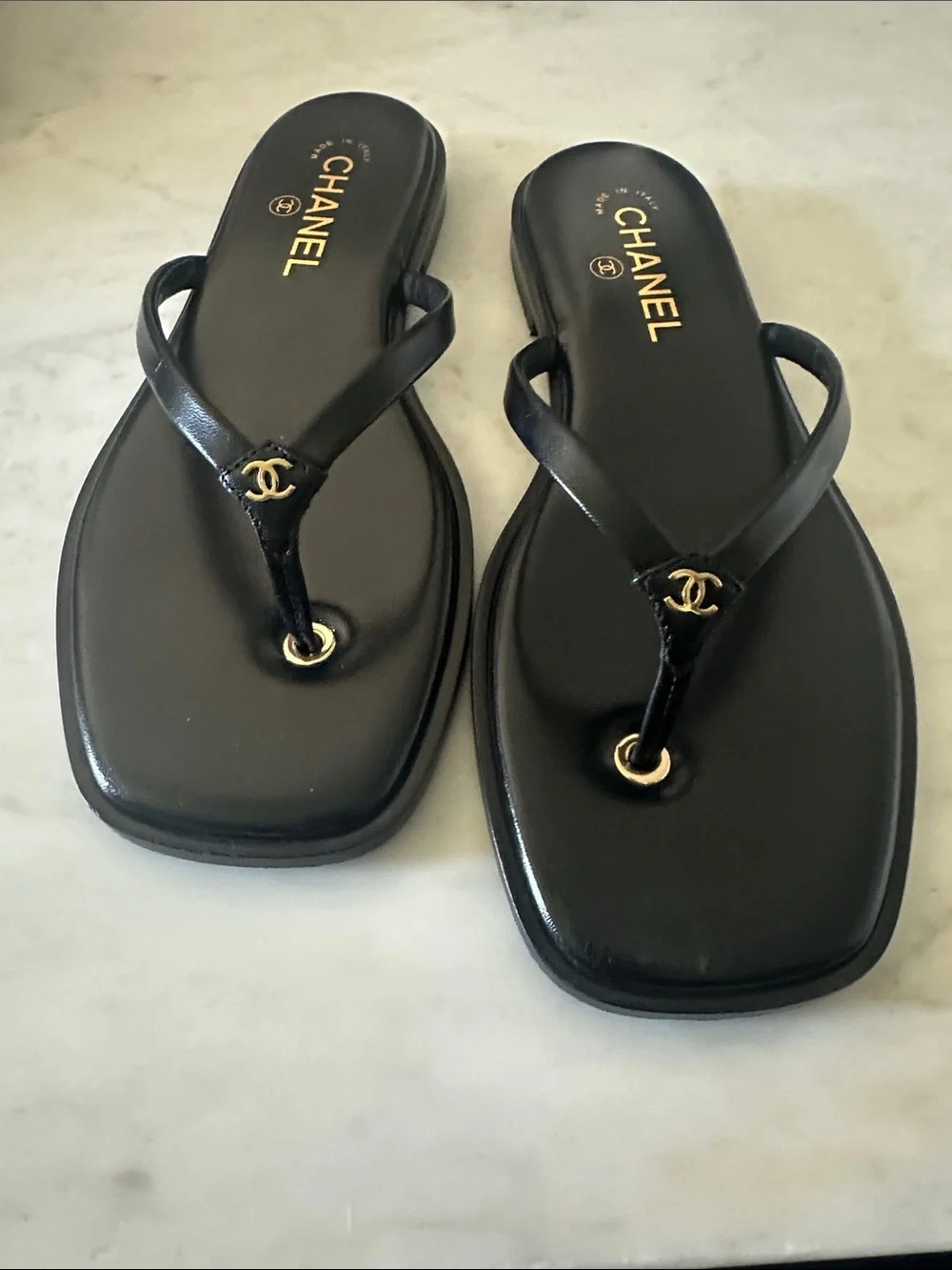 CHANEL Black Leather Thong Sandals with Gold Logo Accent